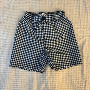 Rufflebutts + Ruggedbutts swim trunks. Size: 5T. Color: Navy Gingham